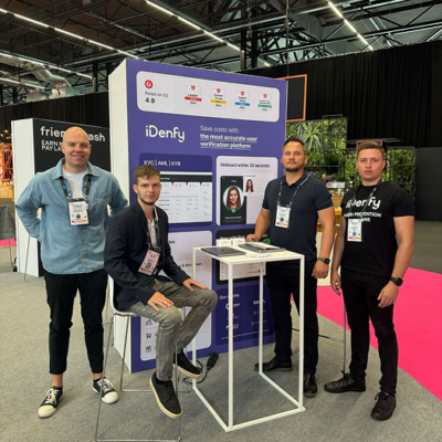 Photo of iDenfy team members at a conference.