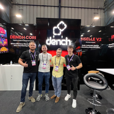 A photo of the iDenfy and Dench team members taken during a conference.
